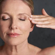 Woman-with-closed-eyes-touching-temple (1)